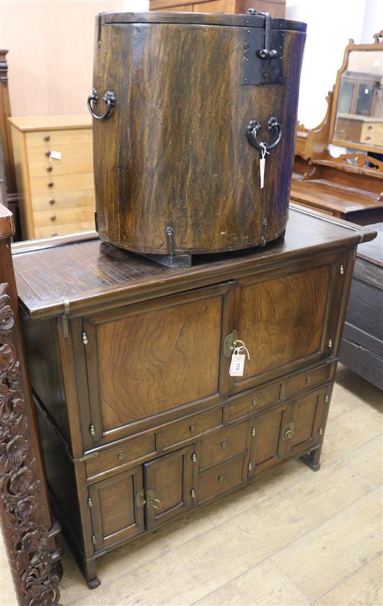 A Korean elm side cabinet and a cylindrical pine/elm chest with wrought iron mounts and hinged top (2) Cabinet W.110cm, Box approx. W60